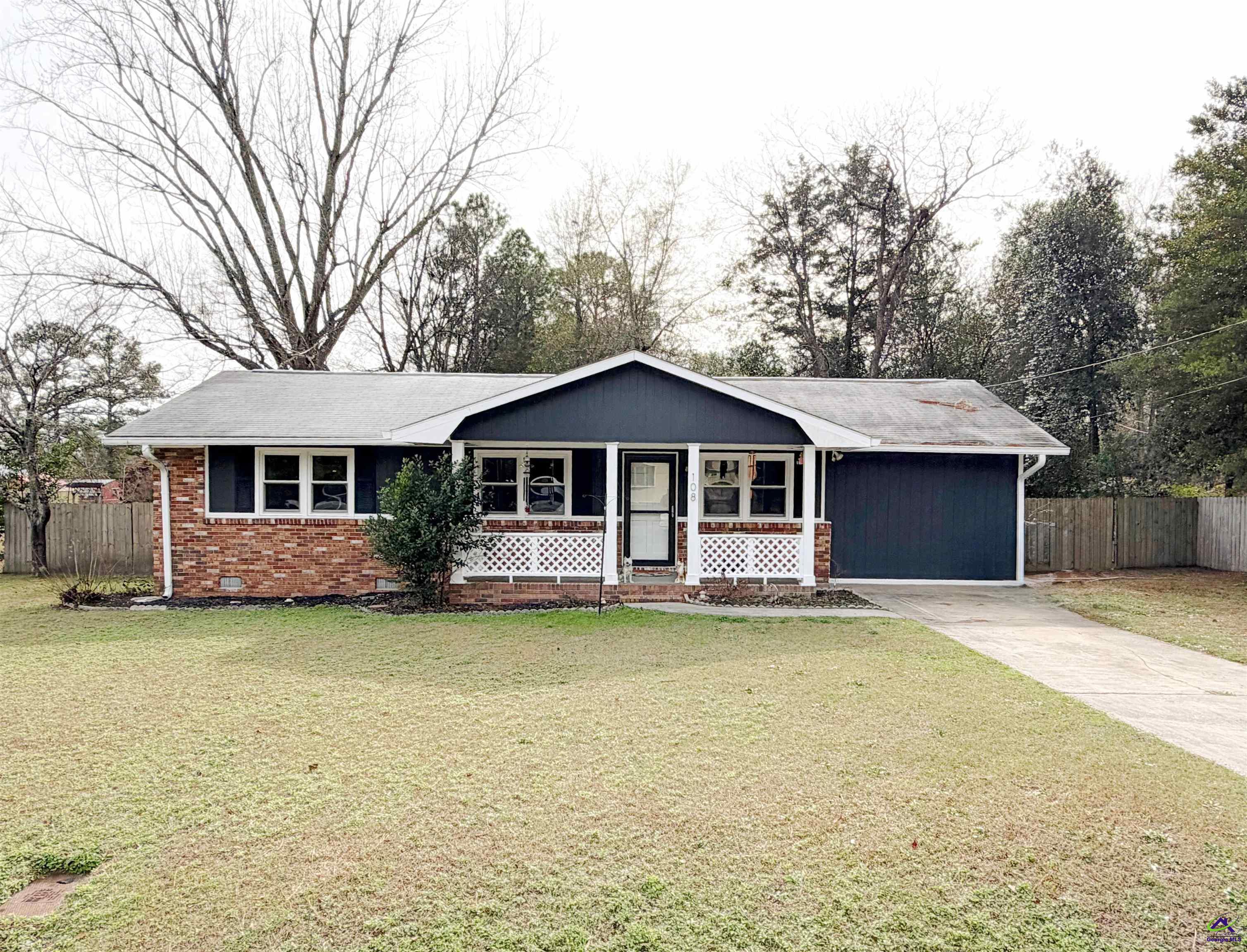 108 Weaver Road Warner Robins, GA 31093 - Photo 1 of 26 a front view of a house with garden