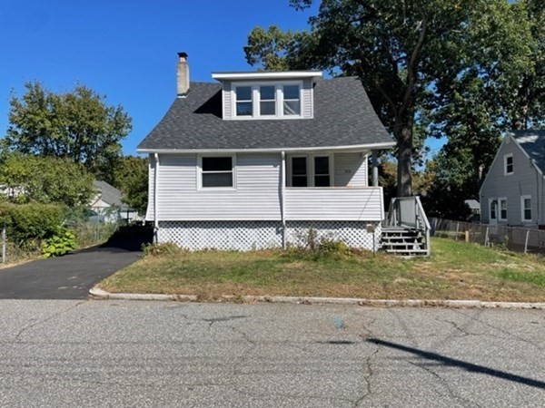 253 Draper Street Springfield, MA 01108 - Photo 1 of 38 front view of house with a yard
