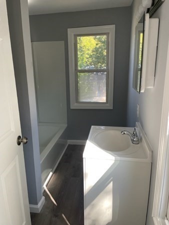 253 Draper Street Springfield, MA 01108 - Photo 18 of 38 a bathroom with a sink and a bathtub