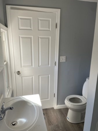 253 Draper Street Springfield, MA 01108 - Photo 19 of 38 a bathroom with a sink a toilet and tub