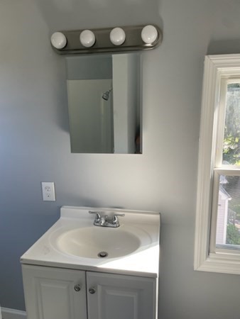 253 Draper Street Springfield, MA 01108 - Photo 20 of 38 a bathroom with a sink and a mirror