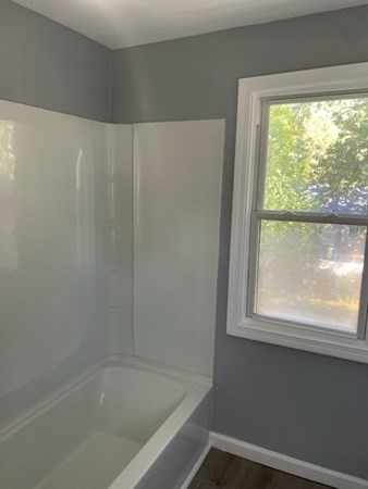 253 Draper Street Springfield, MA 01108 - Photo 21 of 38 a bath tub sitting next to a window