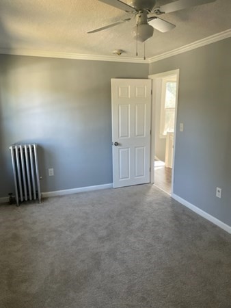 253 Draper Street Springfield, MA 01108 - Photo 23 of 38 an empty room with windows and fan