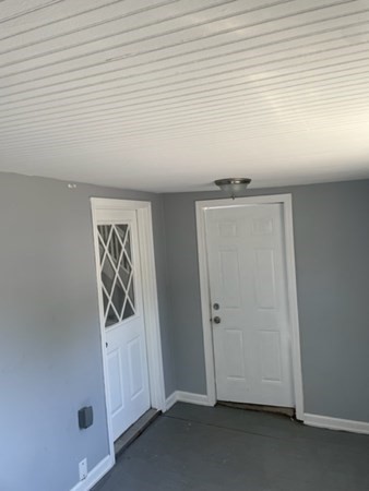 253 Draper Street Springfield, MA 01108 - Photo 5 of 38 an empty room with wooden floor and windows