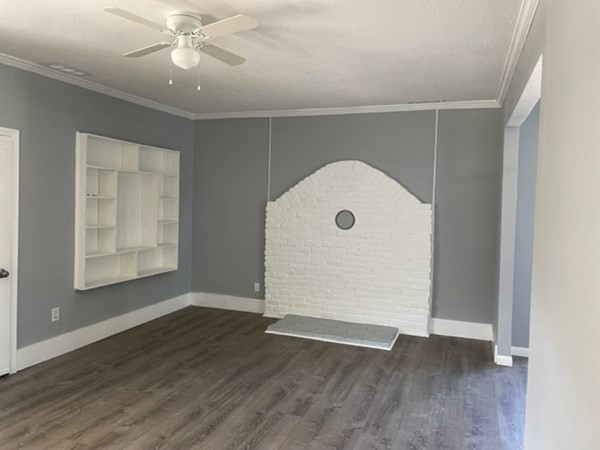 253 Draper Street Springfield, MA 01108 - Photo 7 of 38 an empty room with wooden floor and windows