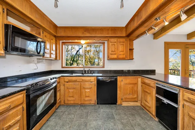 a bed room with a bed and a window