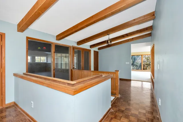 a bathroom with a glass shower door