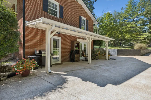 a view of kitchen with furniture and refrigerator