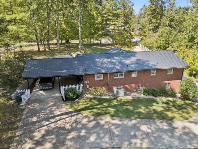 an aerial view of a residential houses with outdoor space