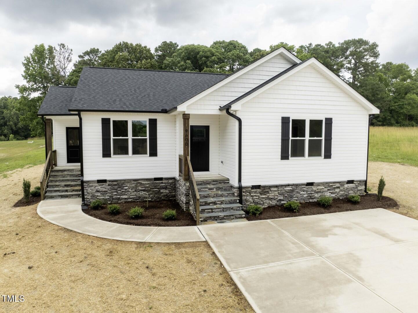 9600 Stallings Road Spring Hope, NC 27882 - Photo 1 of 29 a front view of a house with trees