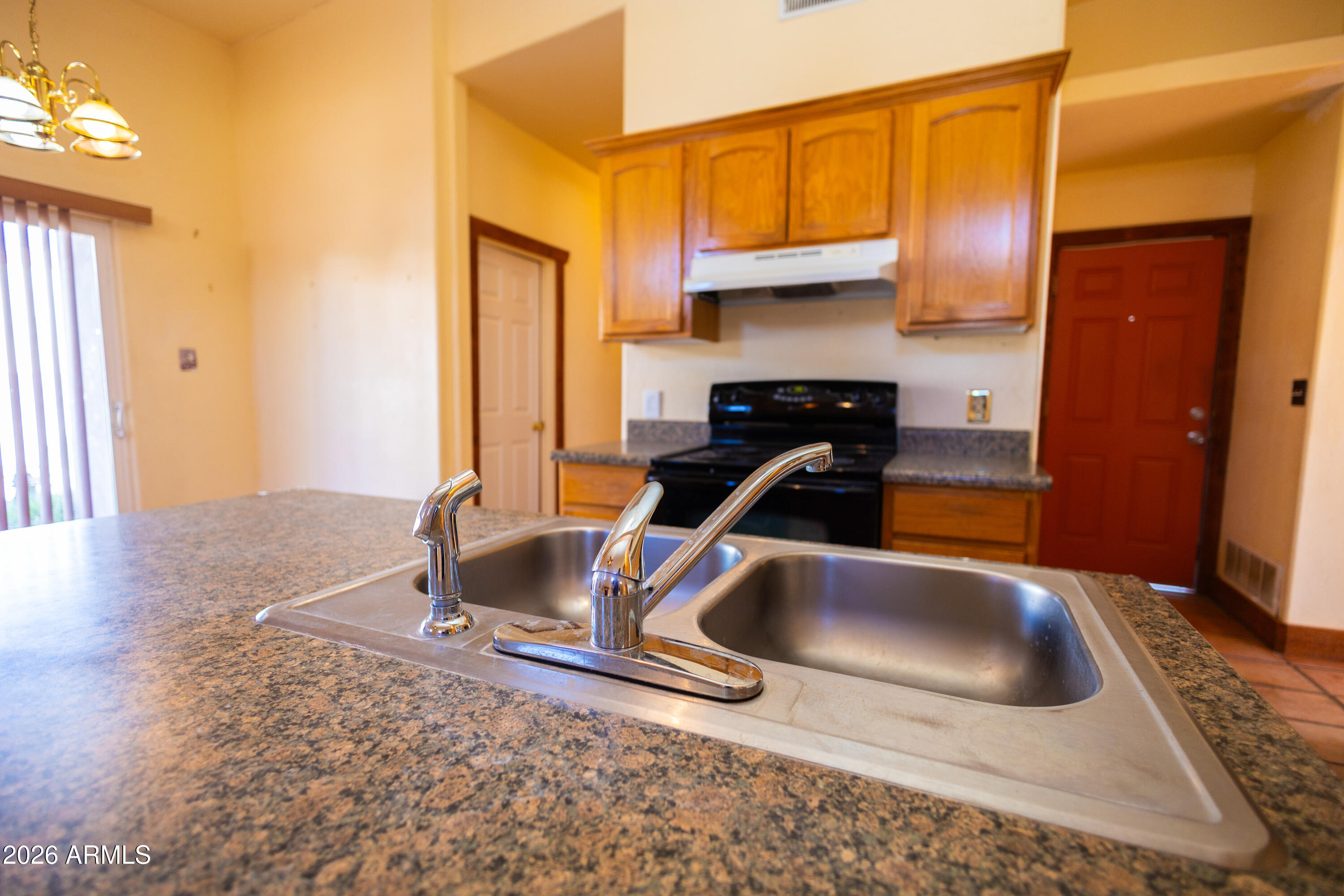 4105 North Washington Avenue Douglas, AZ 85607 - Photo 57 of 61 a kitchen with a sink and a refrigerator