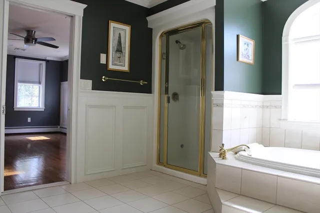 a bathroom with a tub and shower