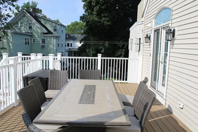 a view of a chair and table in the balcony