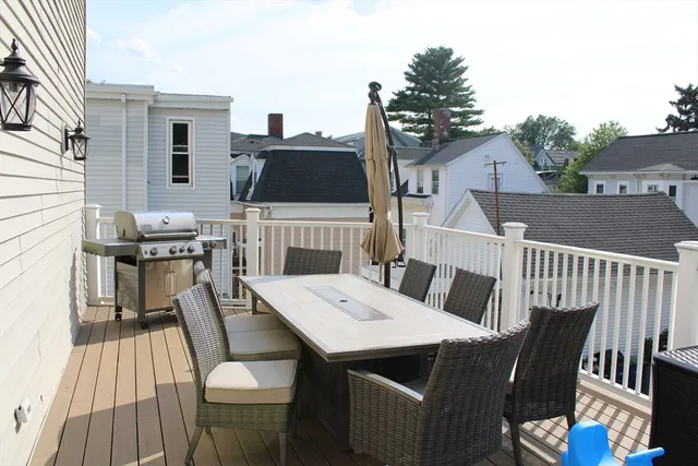 a view of a dinning table and chairs in balcony