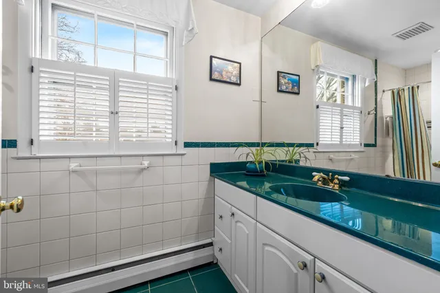 a bathroom with a toilet and a bathtub