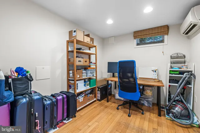 a room with furniture and wooden floor