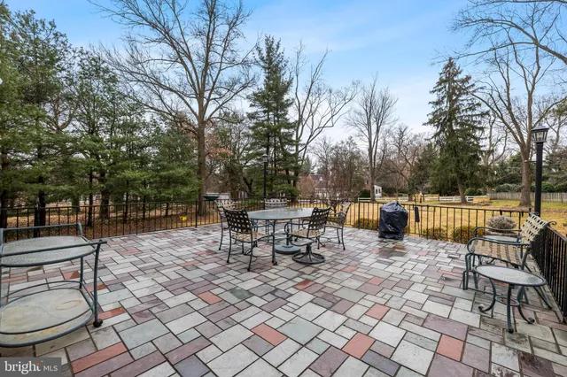 a view of a patio with a dining table and chairs with a patio