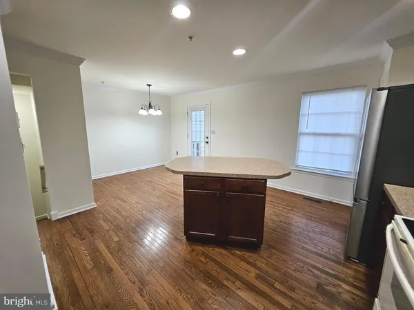 a kitchen with a sink and a refrigerator