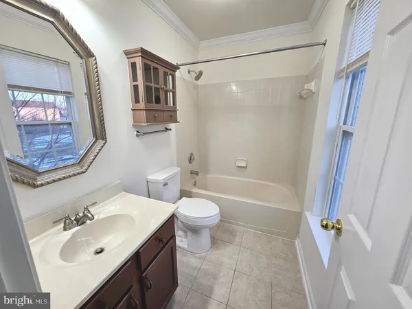 a bathroom with a sink toilet tub and shower
