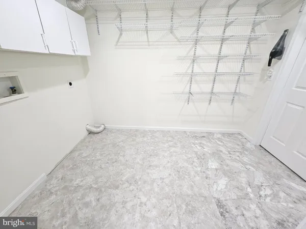 a view of a room with white walls