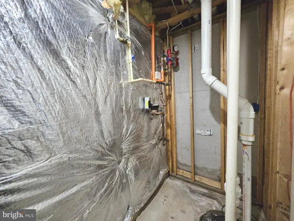 a bathroom with a shower and a glass door