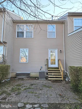 a view of a house with a yard and wooden floor