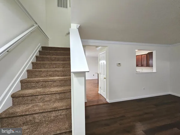 a view of entryway with wooden floor