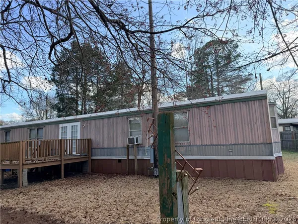 a view of a wooden balcony with wooden floor and fence