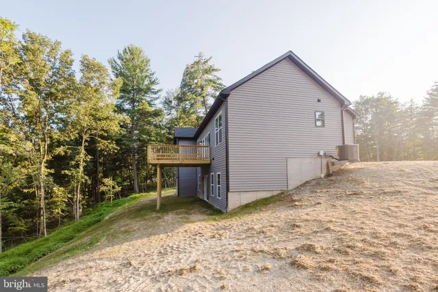 a view of a house with a yard and garage