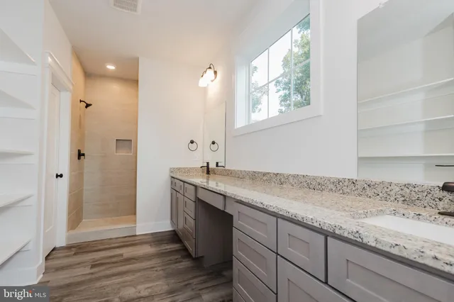 a bathroom with a toilet and a mirror