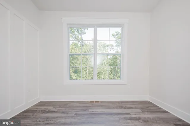 a bathroom with a sink toilet and mirror