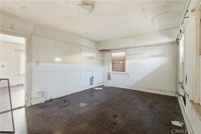 an empty room with a empty space and windows