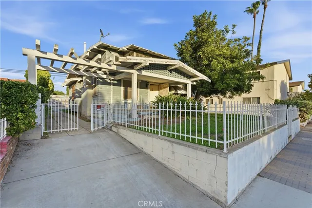 a view of a wrought iron fences in front of house