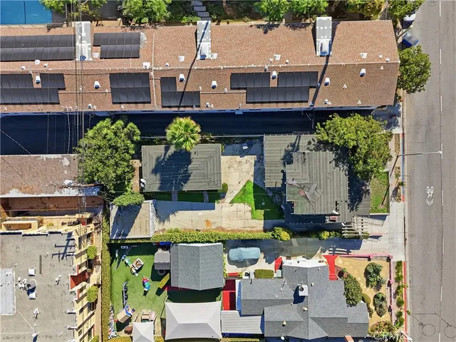an aerial view of residential houses with outdoor space