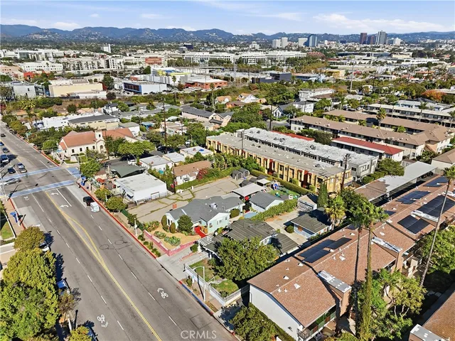 an aerial view of a city with streets and houses