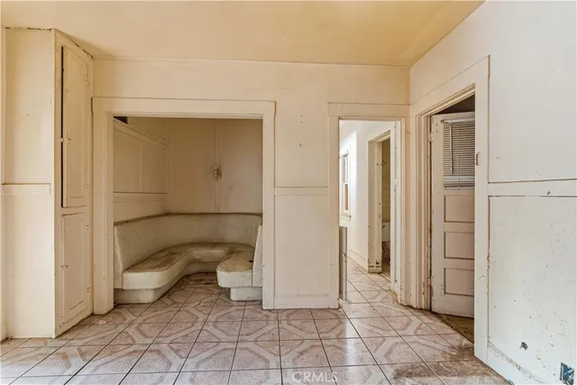 a view of a room with a fireplace and a potted plant