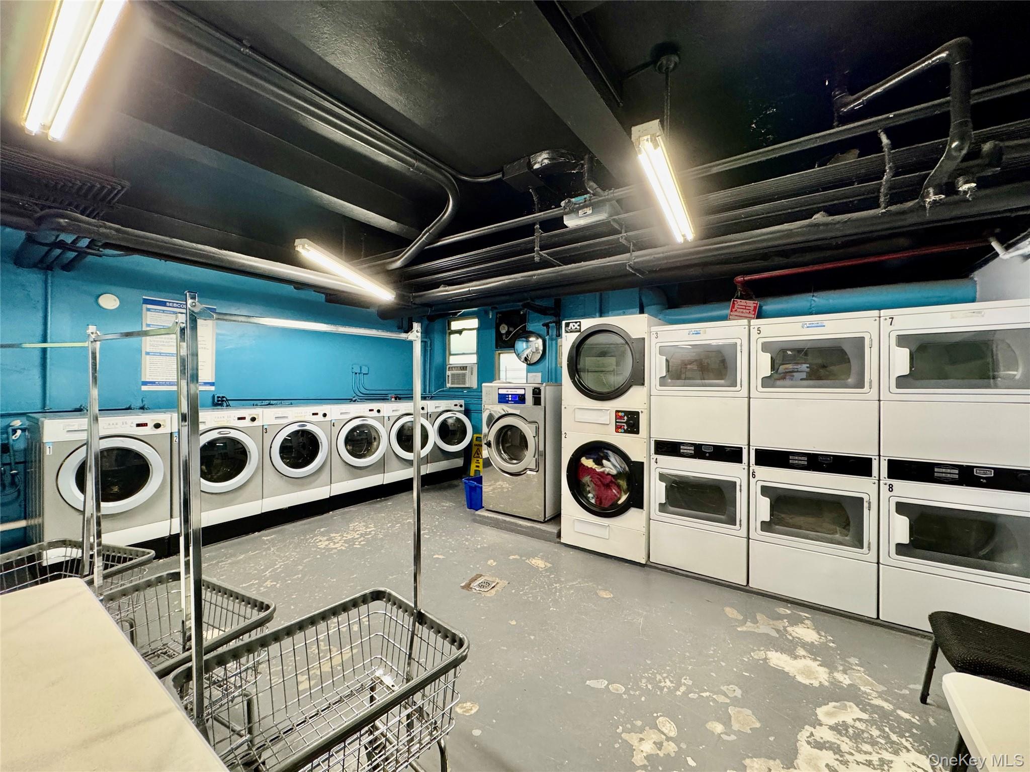 113-14 72nd Road, Unit 1M Queens, NY 11375 - Photo 19 of 20 a utility room with dryer and washer