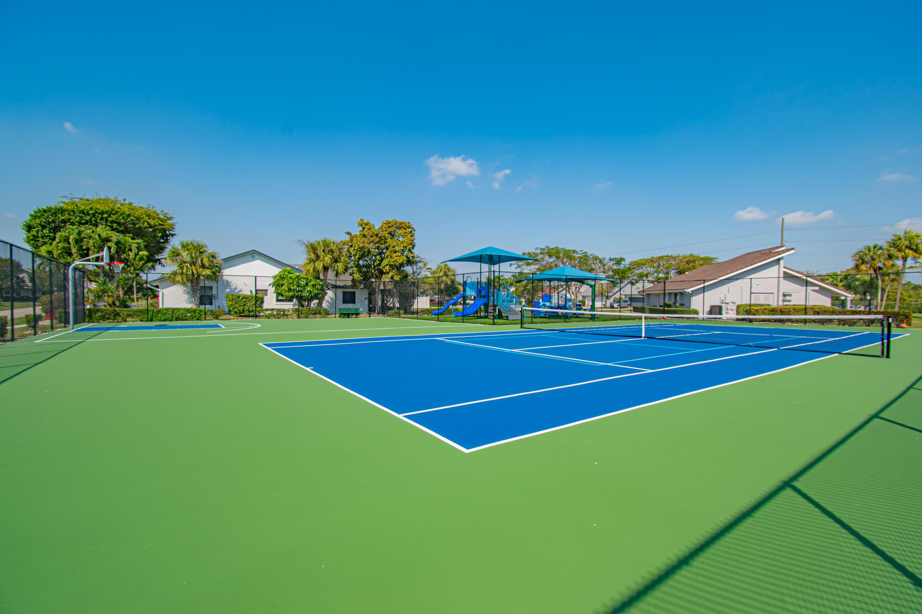 7838 Cypress Crescent Boca Raton, FL 33433 - Photo 22 of 24 a view of an outdoor space and tennis court
