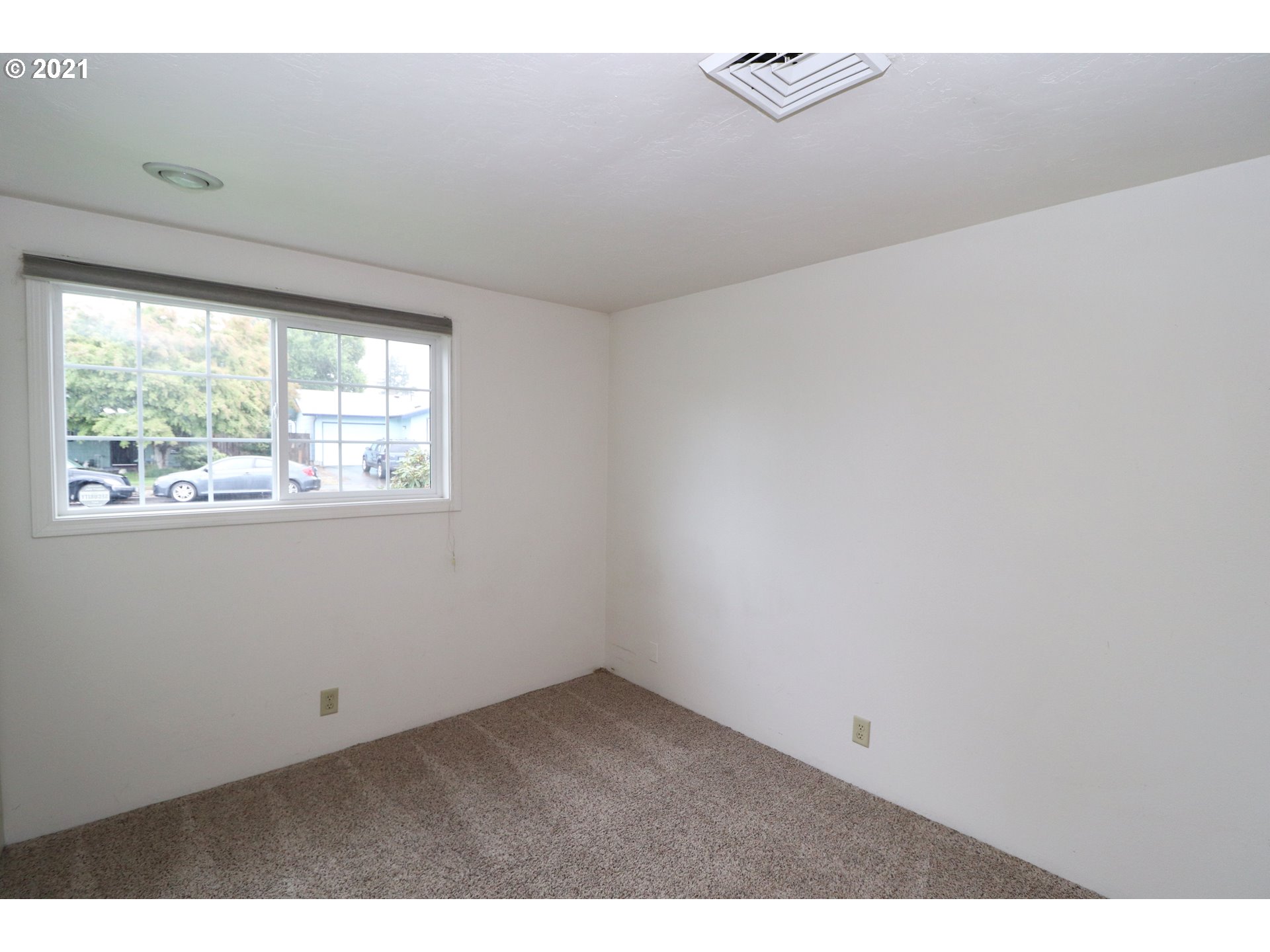2310 6th Street Springfield, OR 97477 - Photo 12 of 32 a view of an empty room and a window