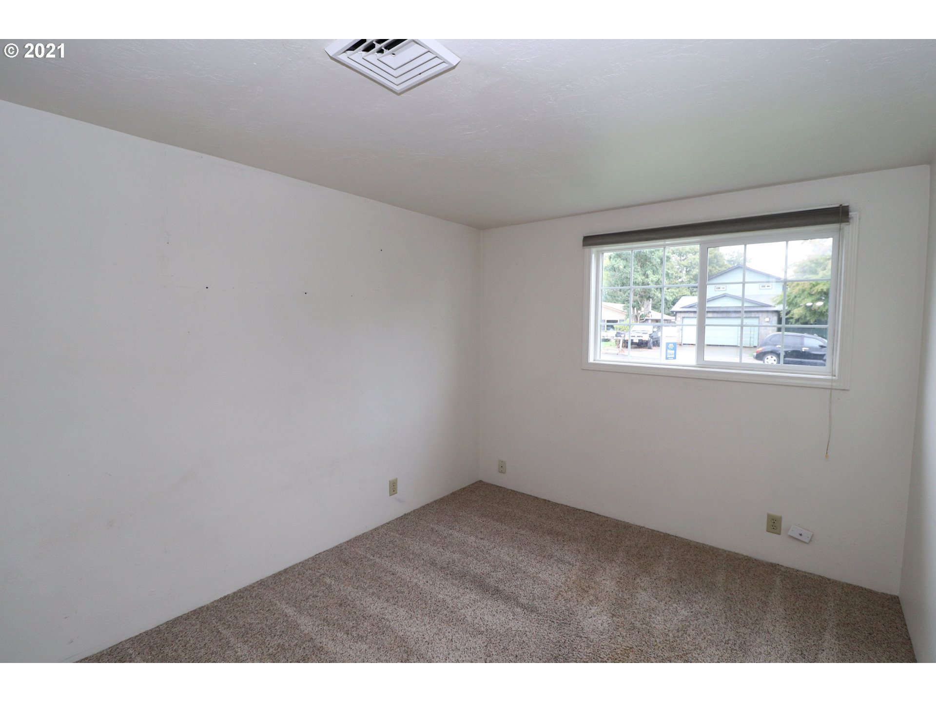 2310 6th Street Springfield, OR 97477 - Photo 18 of 32 a view of an empty room with a window