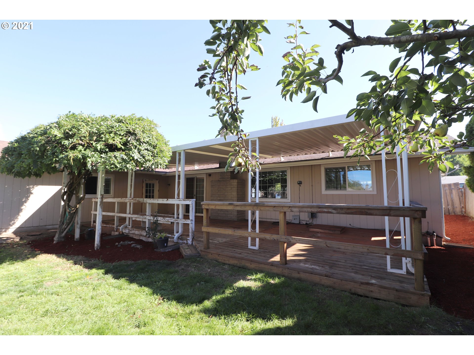 2310 6th Street Springfield, OR 97477 - Photo 28 of 32 a view of a house with backyard porch and sitting area