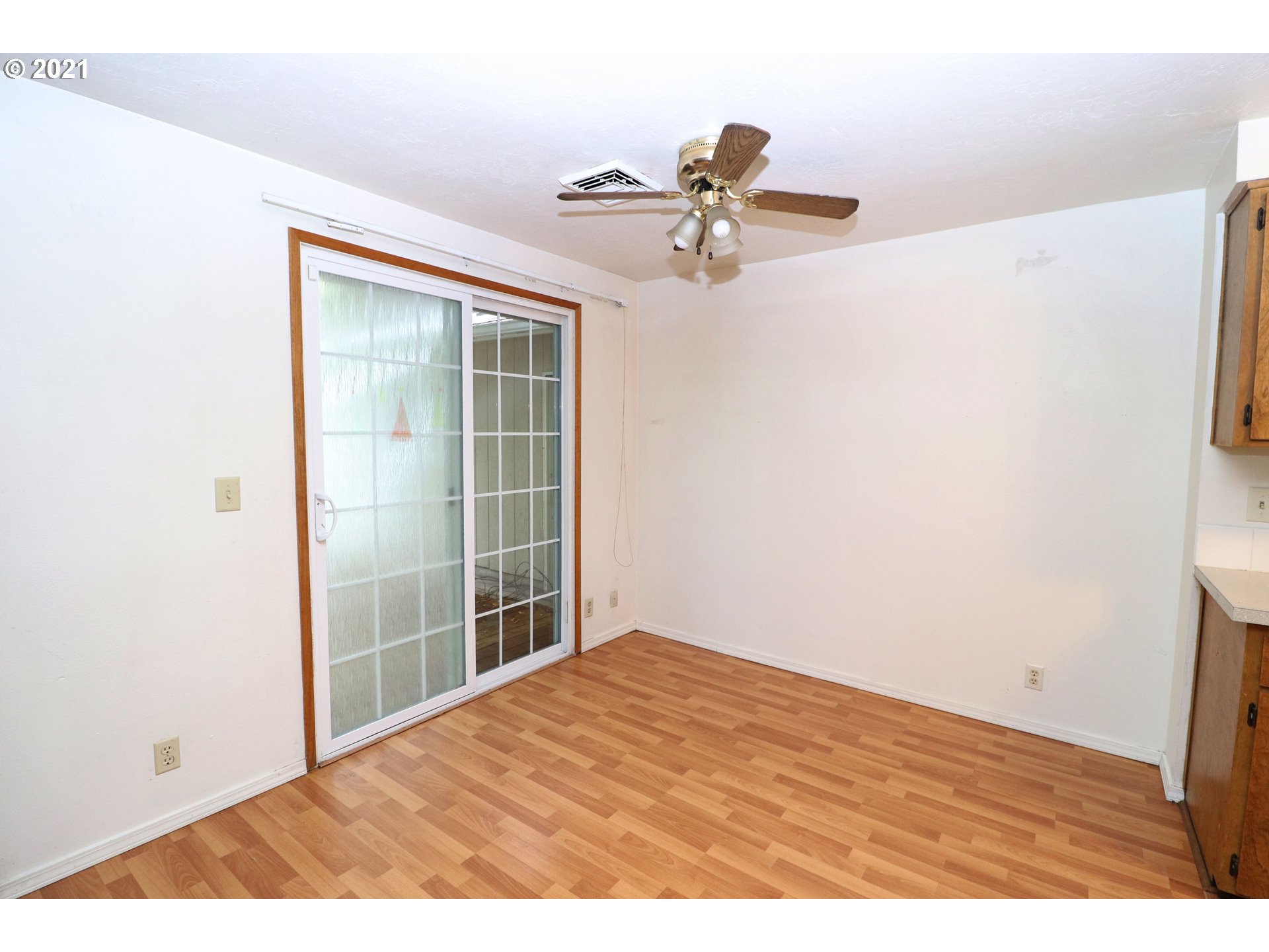 2310 6th Street Springfield, OR 97477 - Photo 6 of 32 a view of empty room with wooden floor