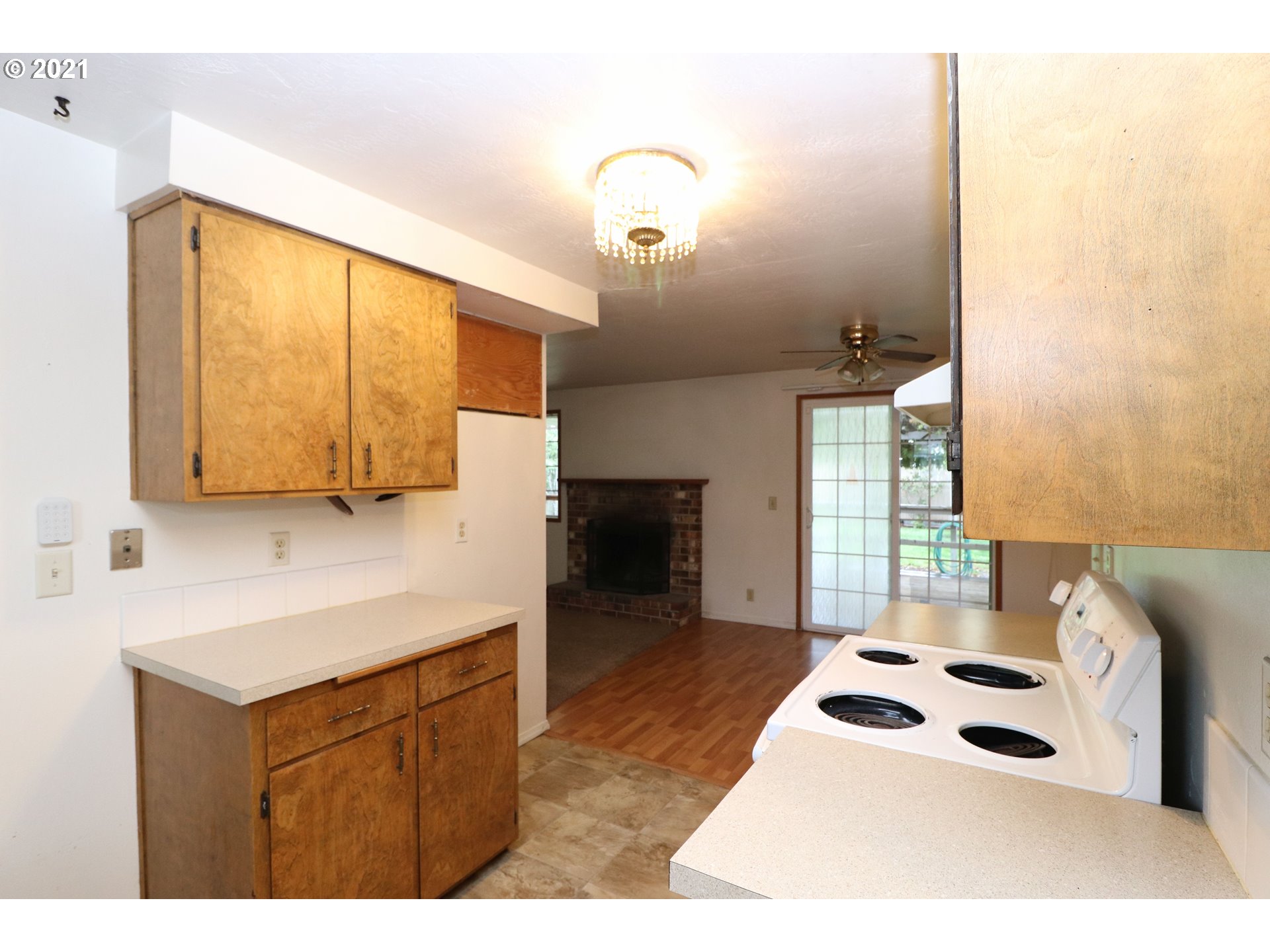 2310 6th Street Springfield, OR 97477 - Photo 10 of 32 a kitchen with a sink a stove and a window