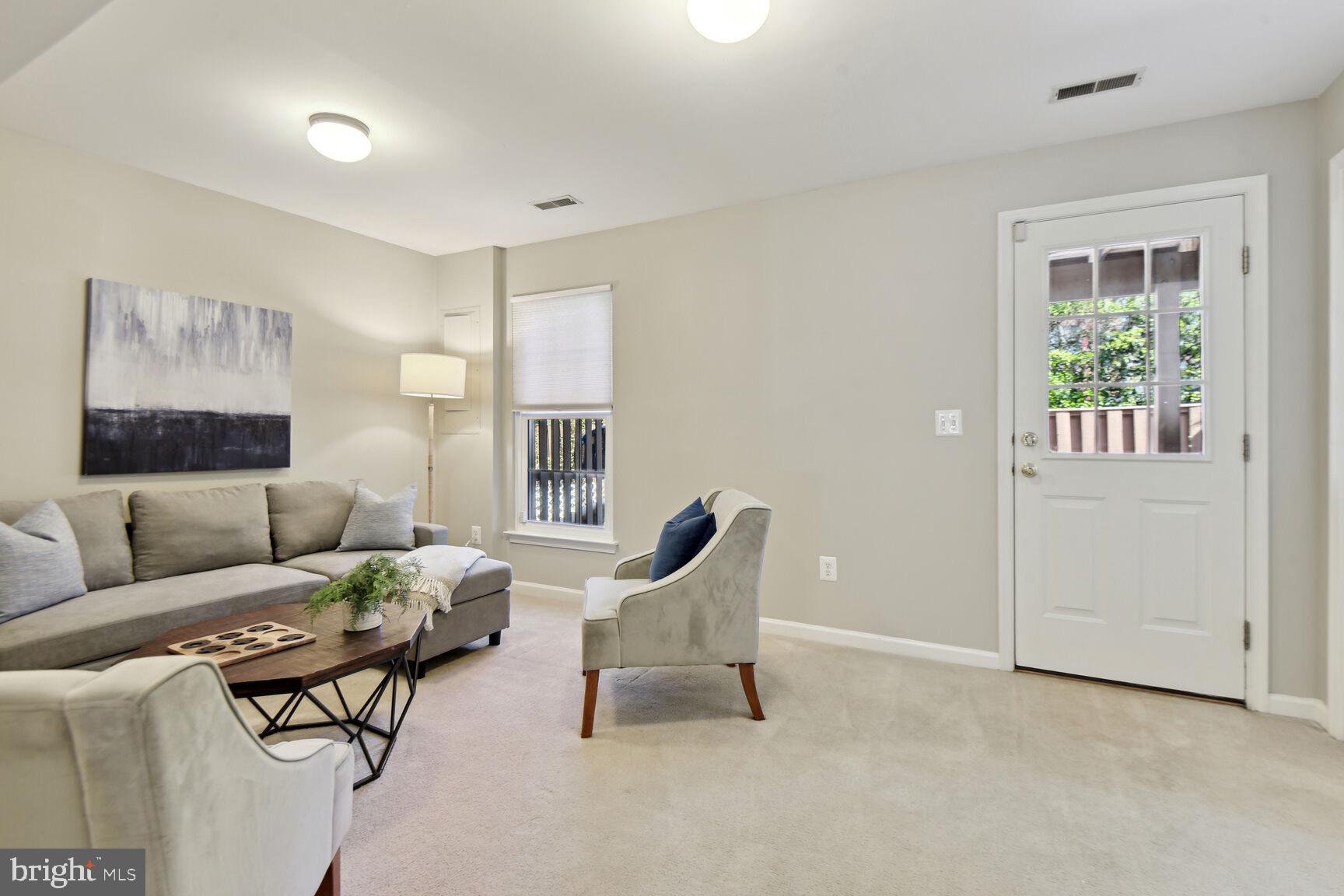 159 Ingle Place Alexandria, VA 22304 - Photo 21 of 25 Family room leading to outdoor patio