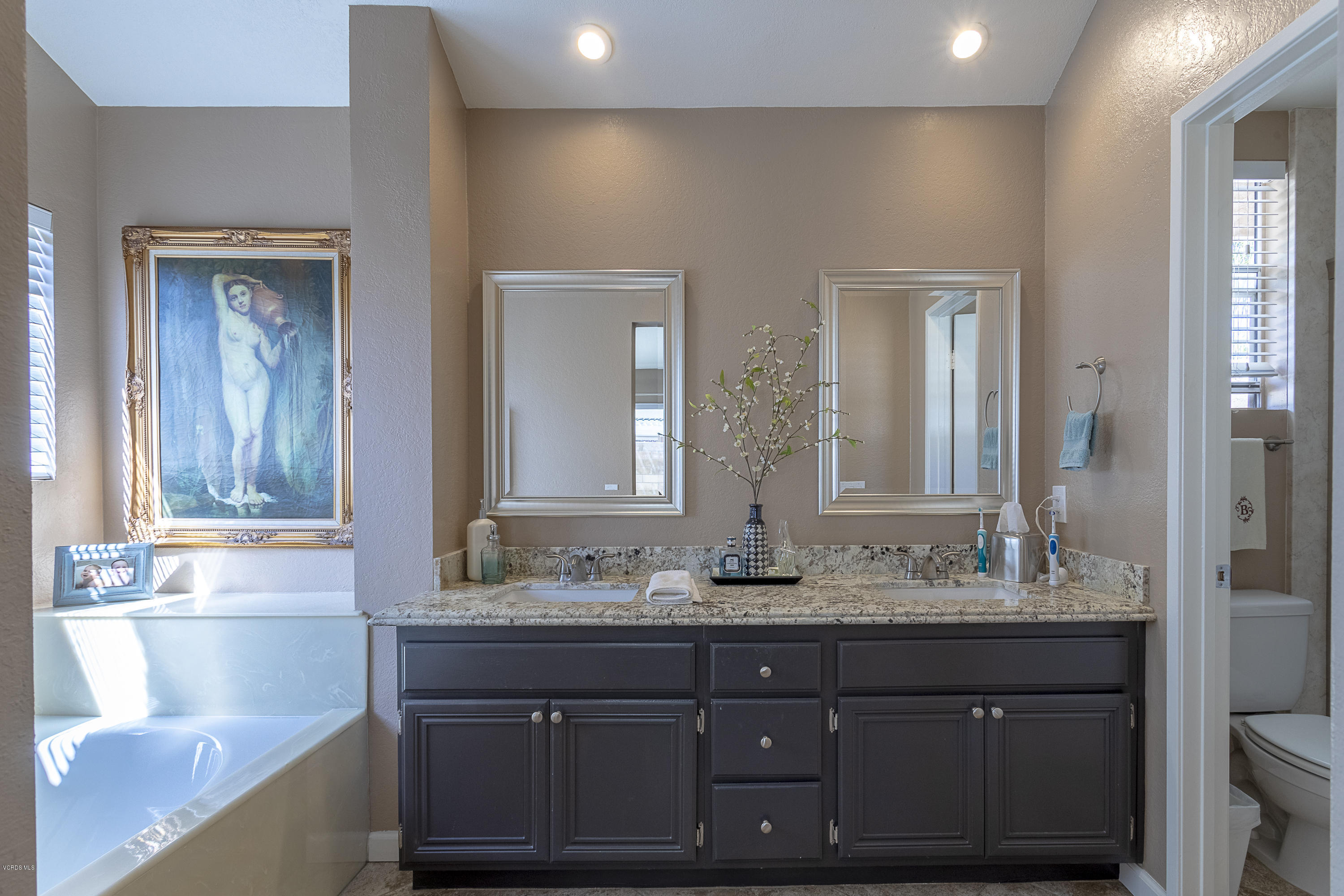 30 Iron Ridge Lane Simi Valley, CA 93065 - Photo 13 of 31 a bathroom with a sink and a mirror