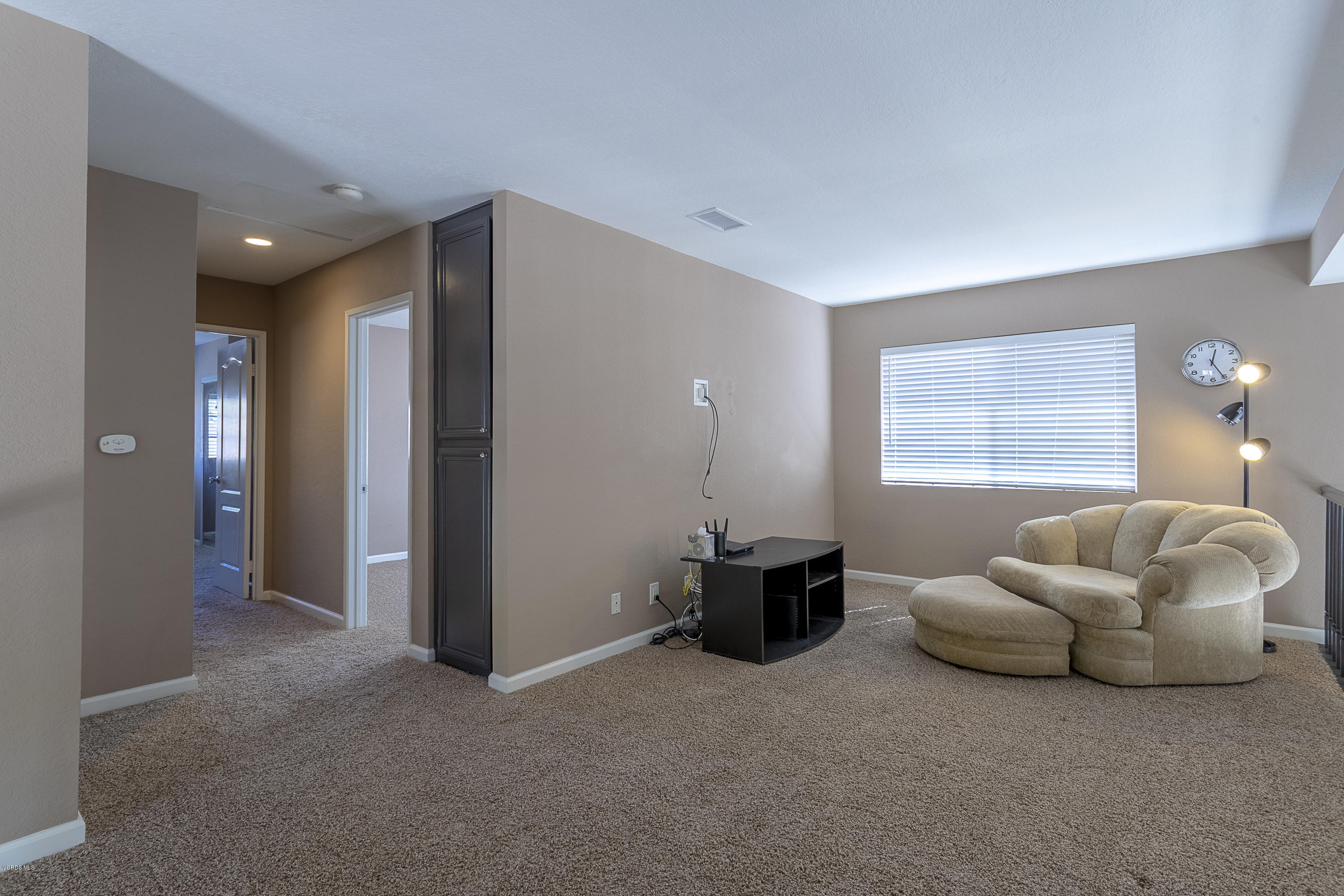 30 Iron Ridge Lane Simi Valley, CA 93065 - Photo 15 of 31 a living room with furniture and a window
