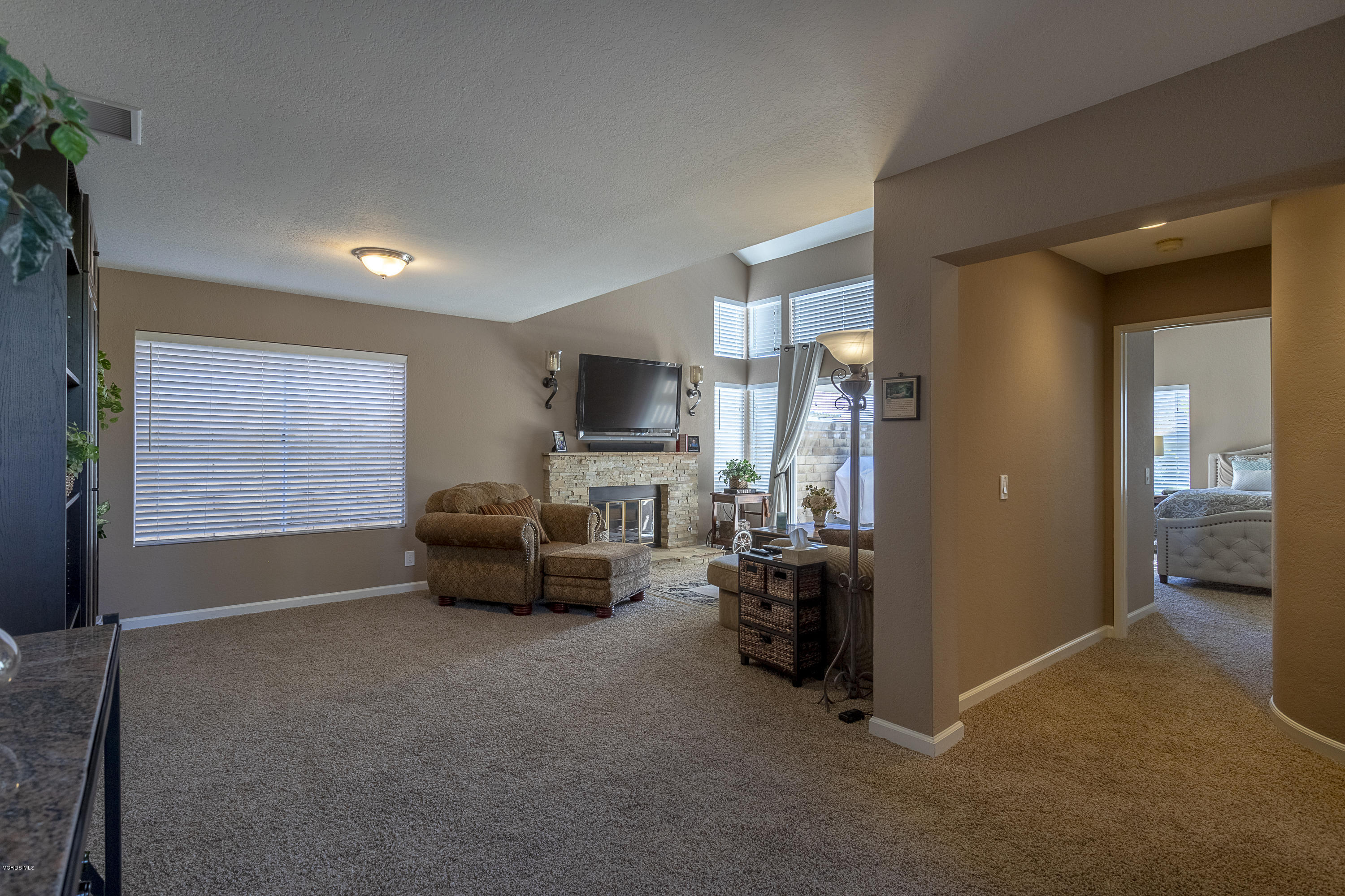 30 Iron Ridge Lane Simi Valley, CA 93065 - Photo 3 of 31 a living room with furniture and a flat screen tv