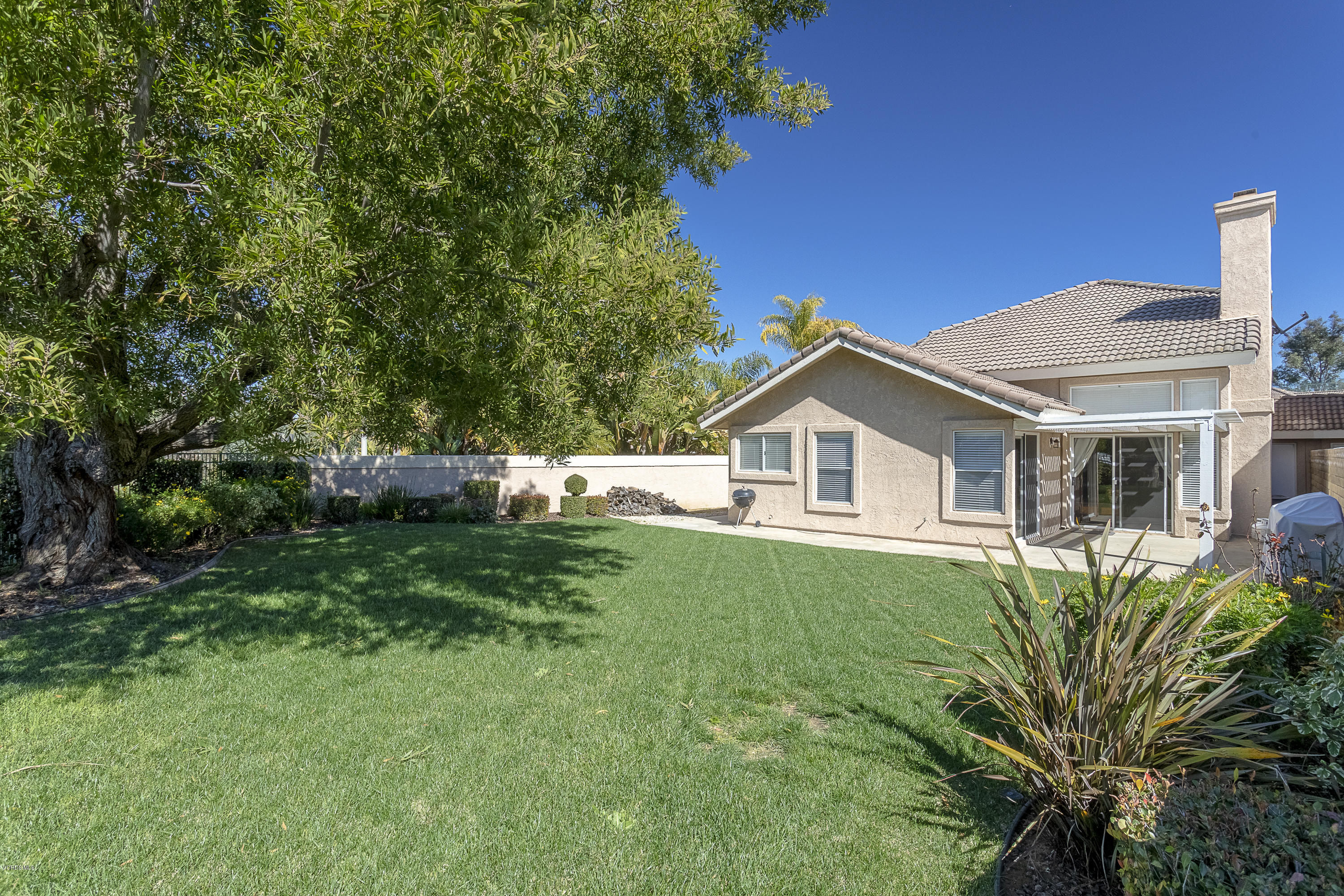 30 Iron Ridge Lane Simi Valley, CA 93065 - Photo 21 of 31 a house with a big yard and large trees