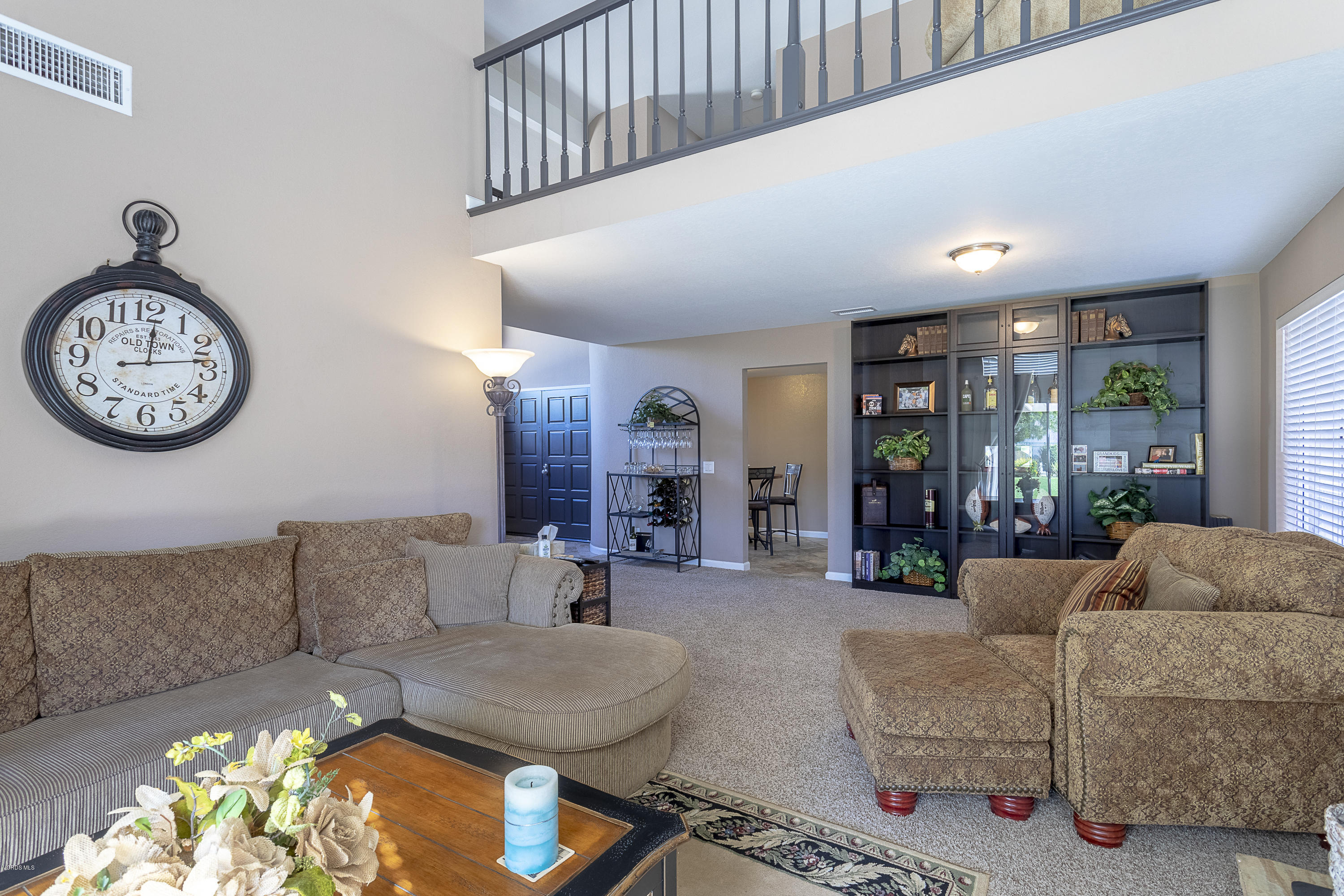 30 Iron Ridge Lane Simi Valley, CA 93065 - Photo 6 of 31 a living room with furniture a clock and a large window