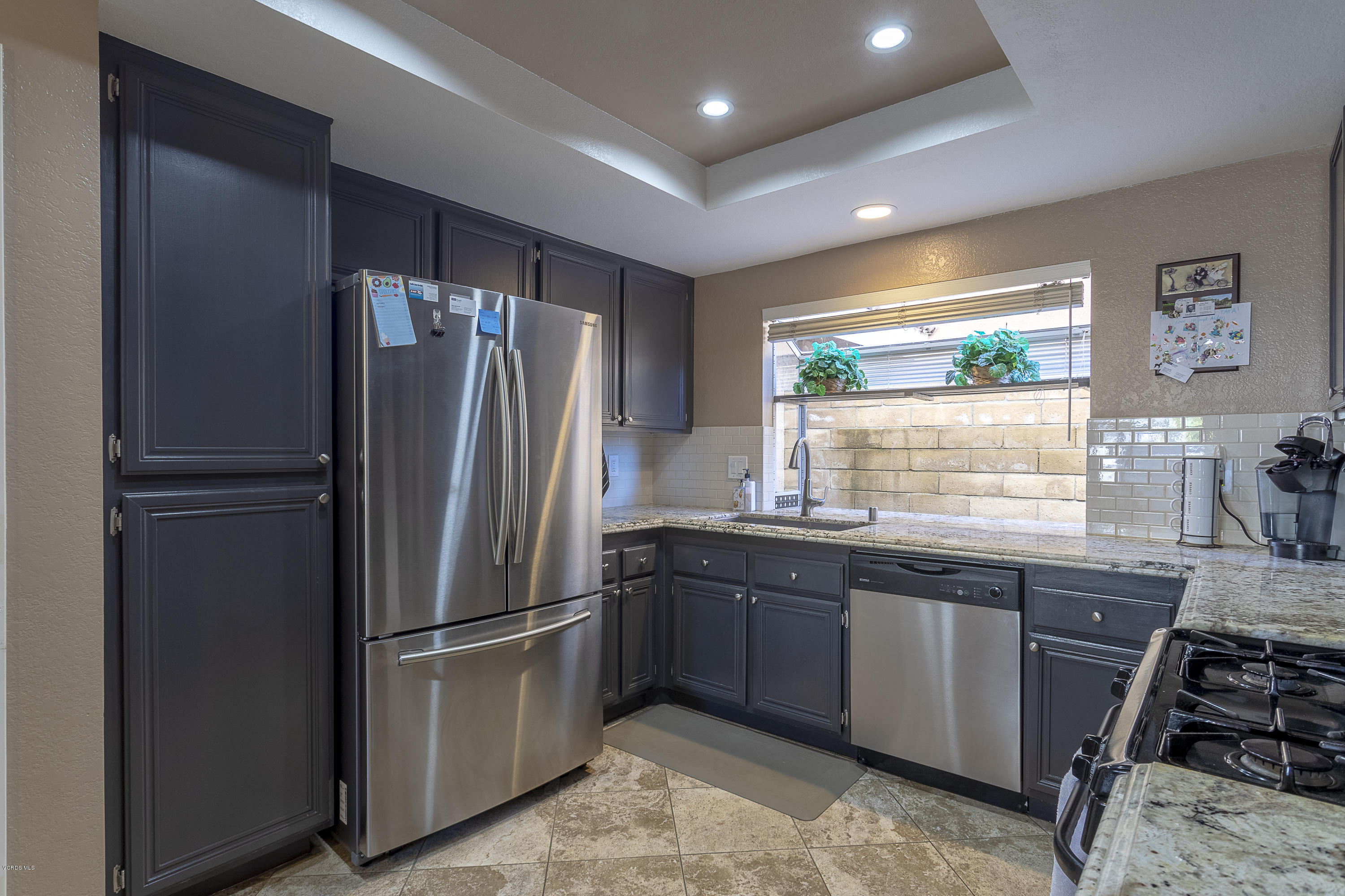 30 Iron Ridge Lane Simi Valley, CA 93065 - Photo 9 of 31 a kitchen with stainless steel appliances granite countertop a refrigerator and a sink